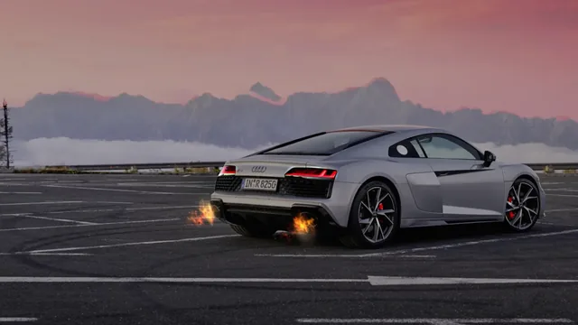 Audi R8 V10 Performance in morning mountain light with exhaust flare