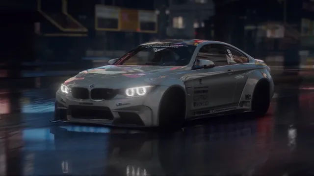 Low silver BMW M4 F82 with widebody styling on a wet city street