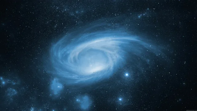 Luminous blue spiral galaxy with a white core in deep navy space