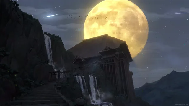 Full moon glowing behind drifting clouds above dark silhouetted landscape at night