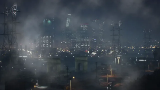 Foggy Los Santos skyline at night with glowing towers and streetlights.