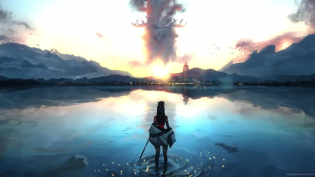 Silhouette of a girl standing on a cliff watching a warm orange sunset sky