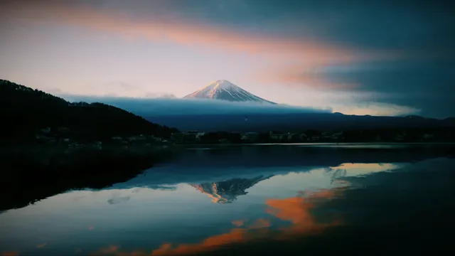 Mount Fuji rising beneath a softly colored pastel sky