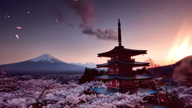 Mount Fuji behind a traditional Japanese temple framed by cherry blossoms.