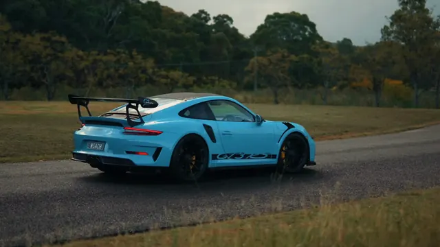 Blue Porsche 911 GT3 RS shown as a bold track-focused sports-car subject.