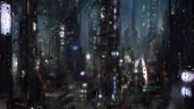 Raindrops on a window with blurred city lights glowing beyond