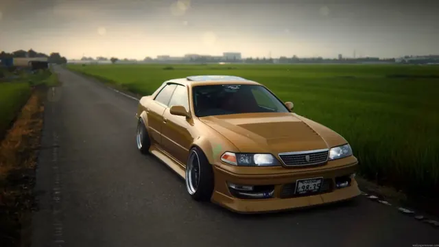 Toyota Mark II JZX100 shown as a clean JDM sedan wallpaper subject.