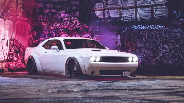 White Dodge Challenger under soft purple light on a rain-covered street